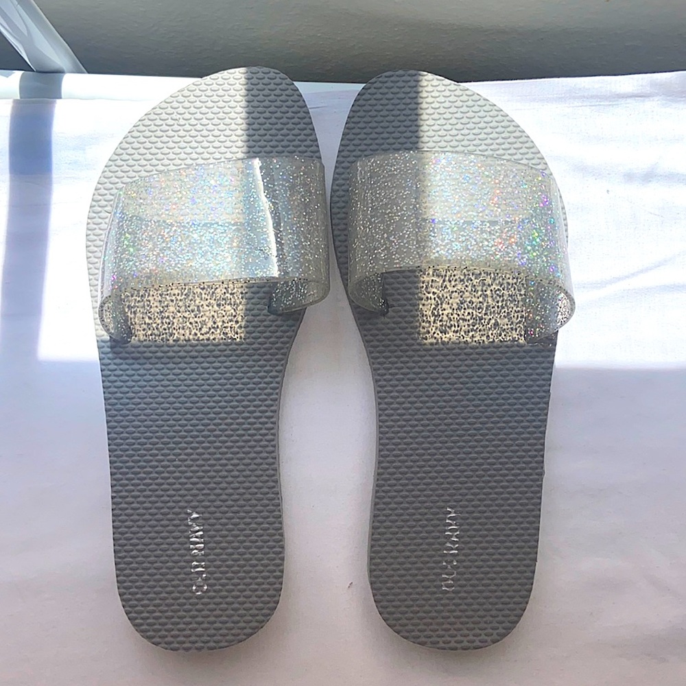 Grey glitter flip-flops.